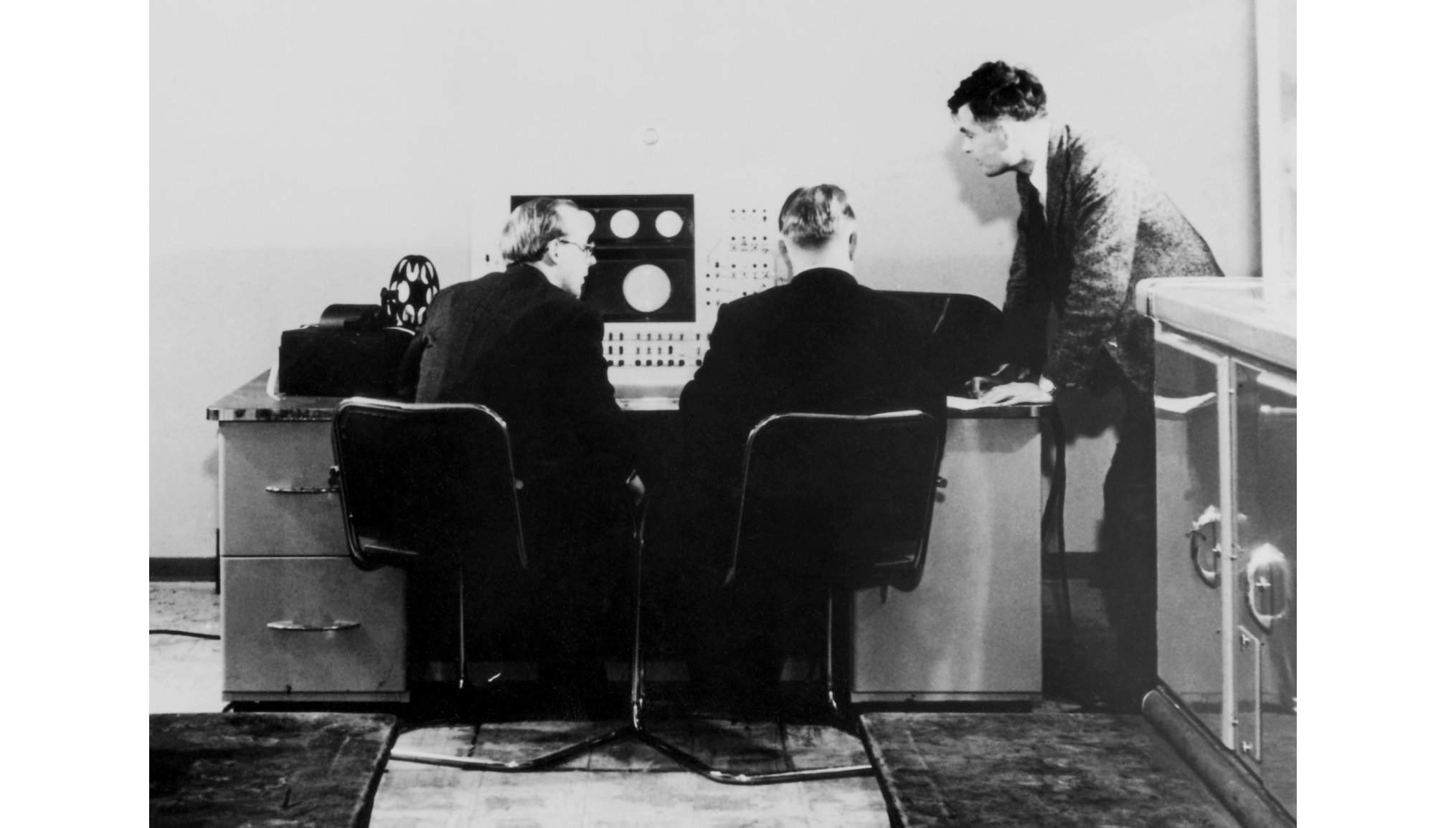 Figure 3: Alan Turing and Christopher Strachey at Mark 1 console,  www.engadget.com/2016/09/26/alan-turings-groundbreaking-synthesizer-music-restored/ (https://www.engadget.com/2016/09/26/alan-turings-groundbreaking-synthesizer-music-restored/).